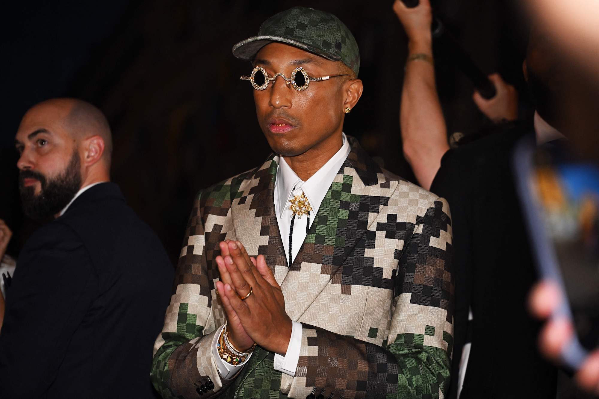 Pharrell Williams flaunts his Louis Vuitton Millionaire bag